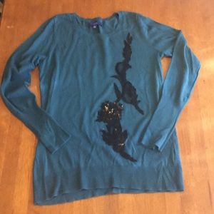 Long sleeve teal shirt with appliqué